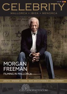 Celebrity Magazine issue 130 front cover showing Morgan Freeman wearing a white shirt with a dark blue jacket and blue jeans while sat on a stall with a background of religious symbols.